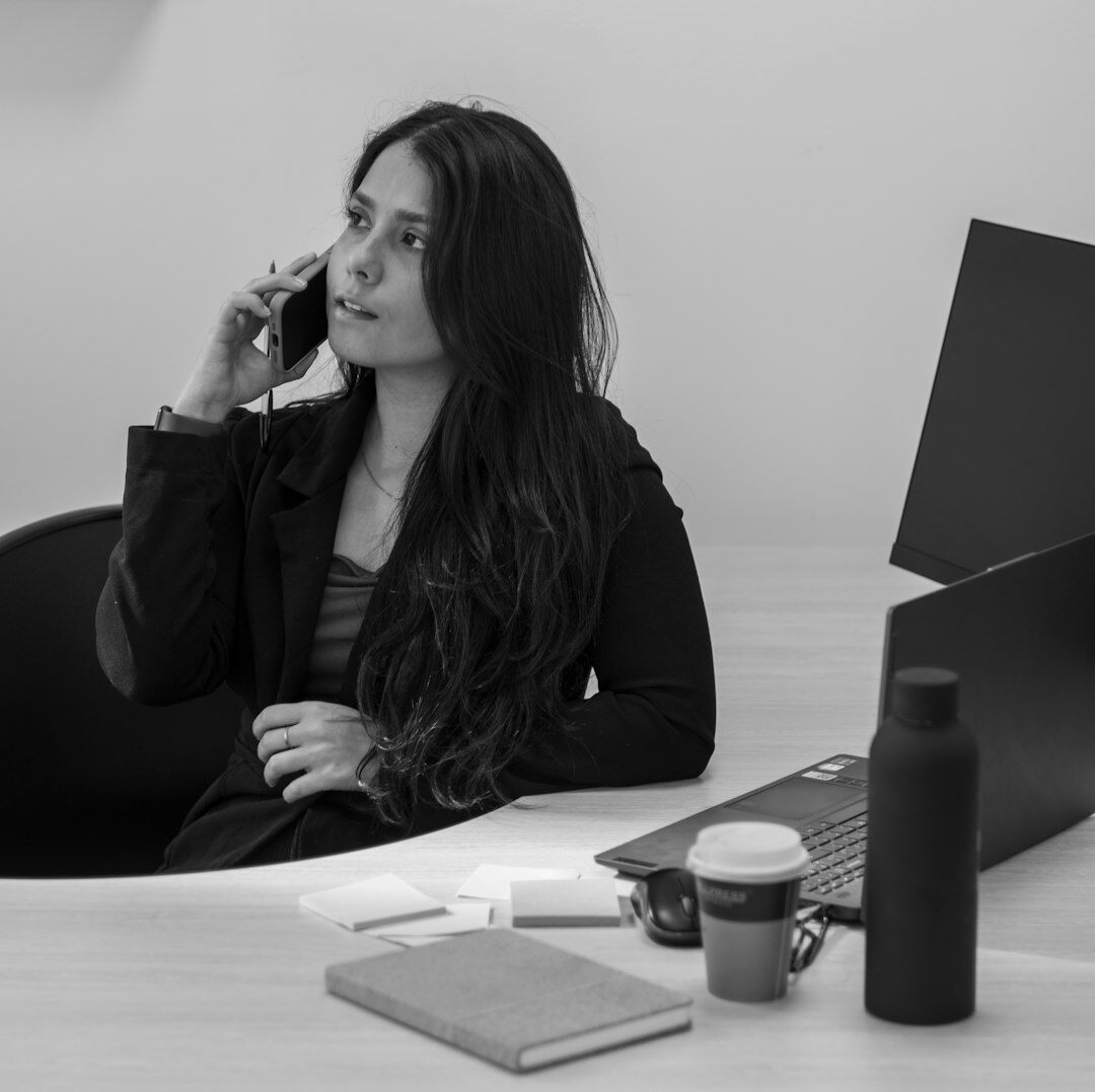Belgian businesswoman in her thirties smiling in a modern studio